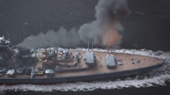 Stock footage of the Battleship Bismarck firing guns in the North Atlantic Ocean