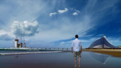 Timelapse footage of a man walking on the beach with Burj Al Arab building in the background